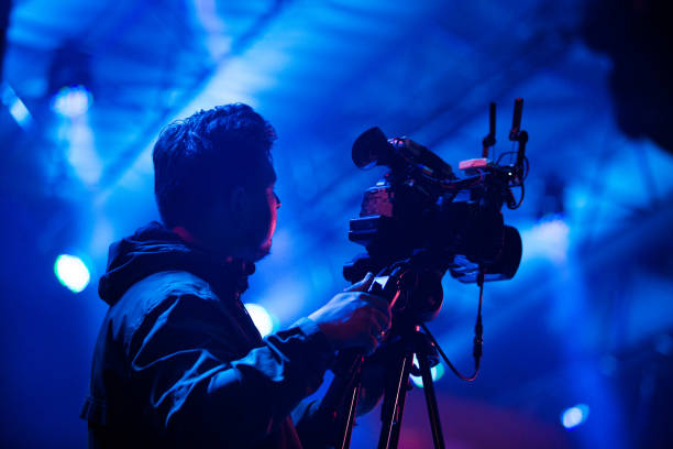 Camera operator at work Camera operator translating live concert on music festival in Kaliningrad camera man stock pictures, royalty-free photos & images