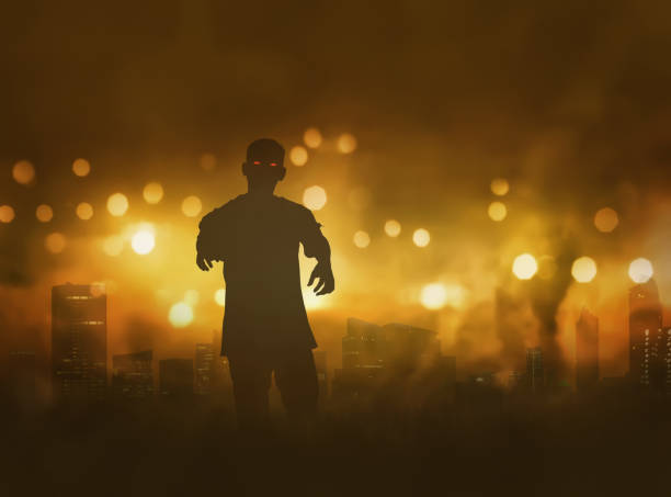 istock Silhouette of zombie with scary red eyes walking 828472744