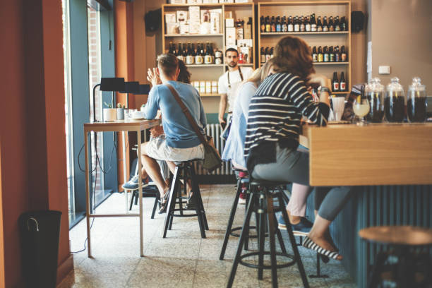 istock People relaxing in cafe bar 828473026