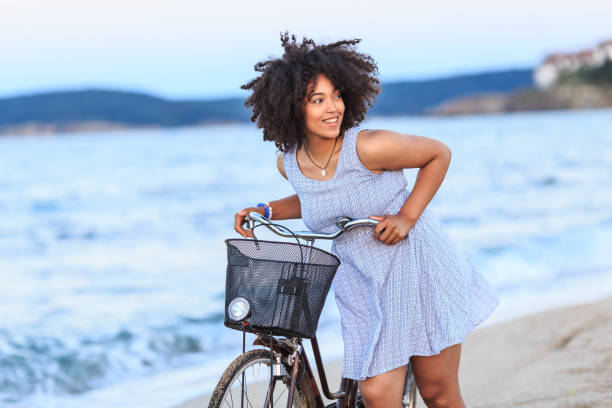 istock Woman riding on beach 828476336