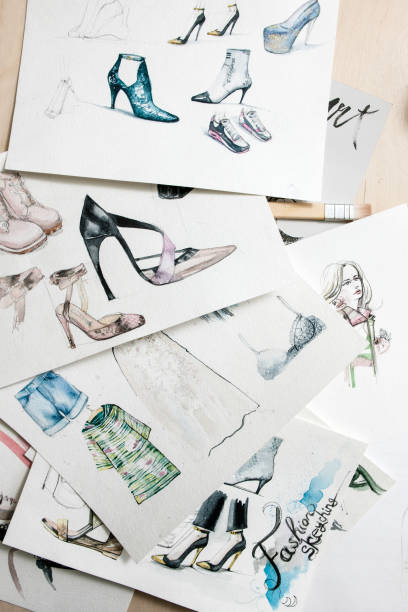 Patterns of fashion sketching models of footwear and clothing. Workplace of fashion designer