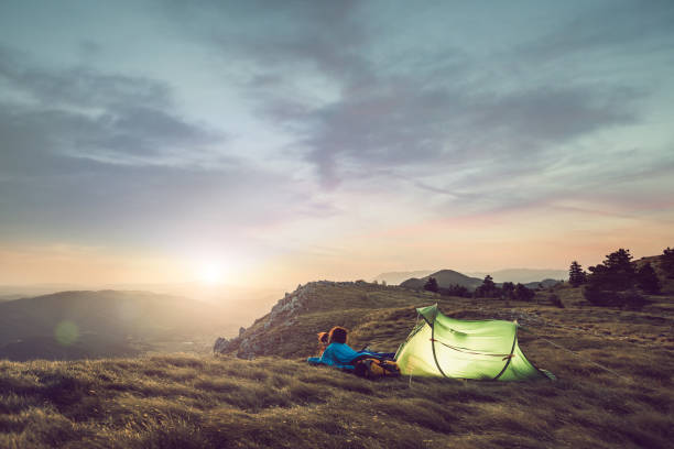 Young Couple Camping on Top of Hill