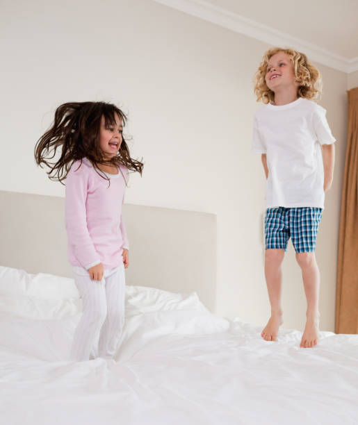 istock Portrait of children jumping 828481882