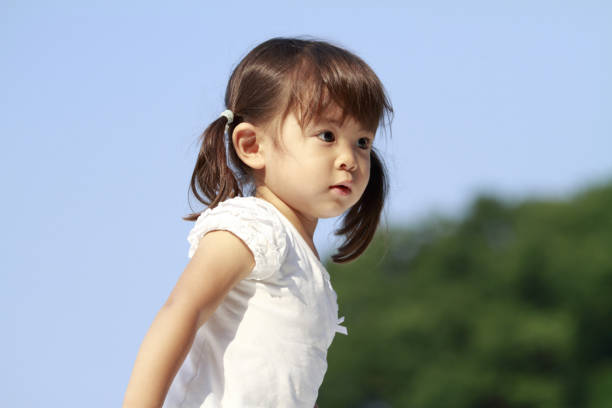 Japanese girl running on the grass (2 years old)