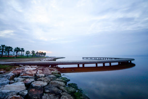 istock old wooden pier at sunset time 828493478