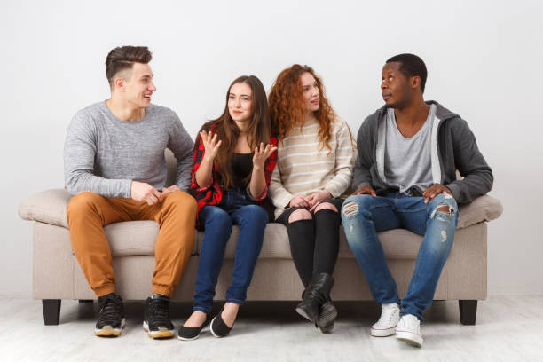 istock Leisure and party time, friends sitting on couch 828493632