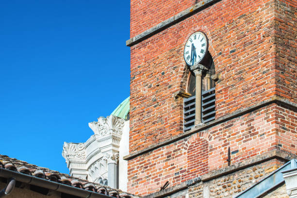 This picture was taken in public area. Close-up of french church architecture building exterior of Ars-Sur-Formans Basilica in Ain, in Dombes region in Auvergne-Rhone-Alpes near Lyon city, eastern France (Europe). The name Ars appeared early 969, and since mid 19th century this name is associated with its canonized parish-priest, Saint Jean-Marie Vianney (also known as curé d'Ars). Before his 1925 canonisation by Pope Pius XI there were many pilgrimages to this small city. Built by Pierre-Marie Bossan, architect of the Basilica of Fourvière in Lyon. Built on the foundations of the Romanesque church of the 12th century, the basilica was enlarged in 1862.