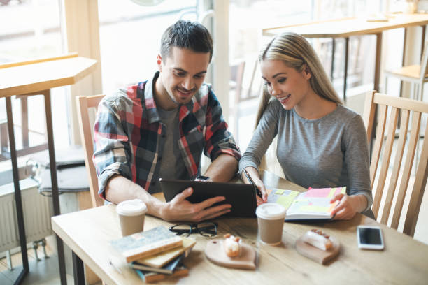 istock Nice looking man and woman in cafe 828497496
