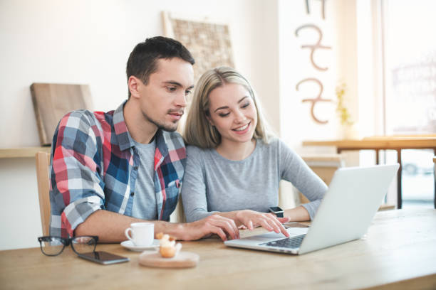 istock Nice looking man and woman in cafe 828498286