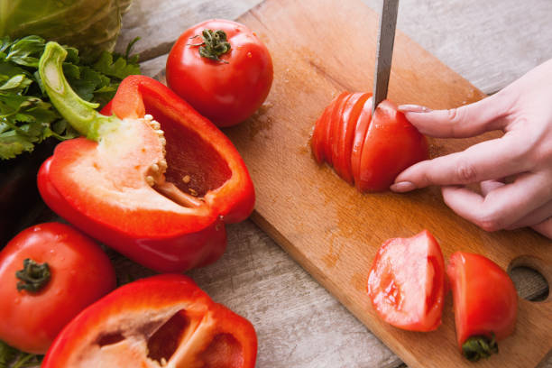 istock Tomatoes cutting on wooden desk 828502804