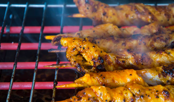 istock Grill, chicken meat in marinade on electric grill 828504422