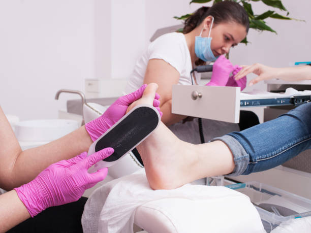 istock Simultaneous gel polish manicure and pedicure 828507140
