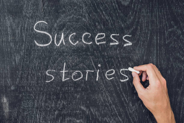 istock Success stories written on the blackboard using chalk 828507310