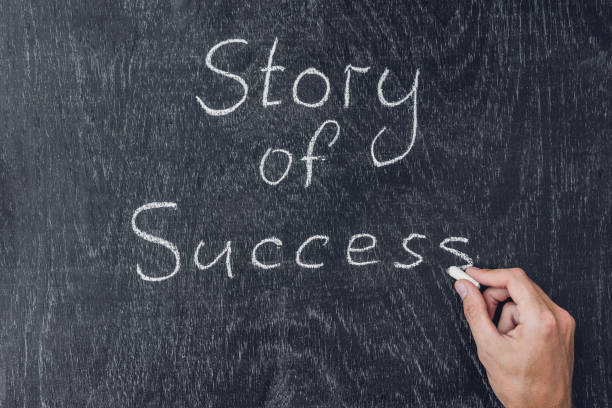 istock Success stories written on the blackboard using chalk 828507324