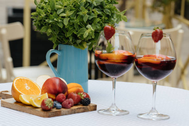 istock Delicious Red Sangria with fruits on table 828513824