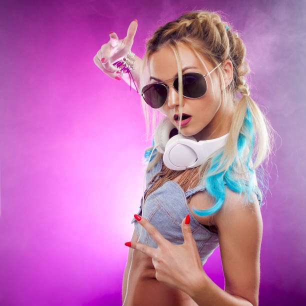 istock Disco girl with colored strands in her hair. Dancing. Retro style 828514130