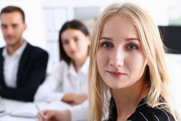 istock Beautiful smiling cheerful girl at workplace look in camera 828514754