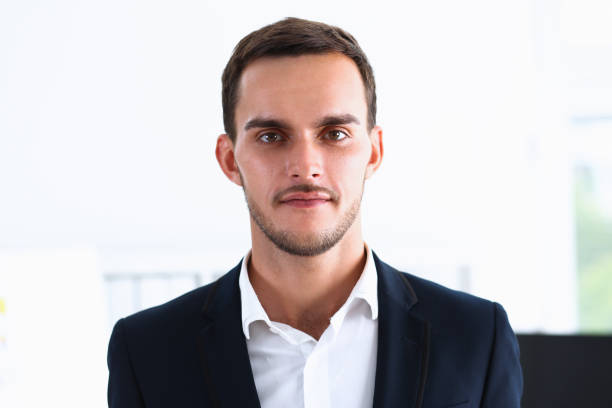istock Handsome man in suit look in camera 828514790