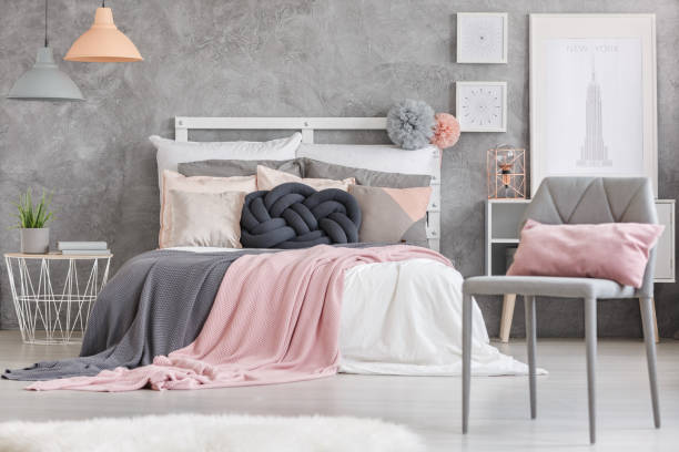 istock Gray chair with pink pillow 828515334
