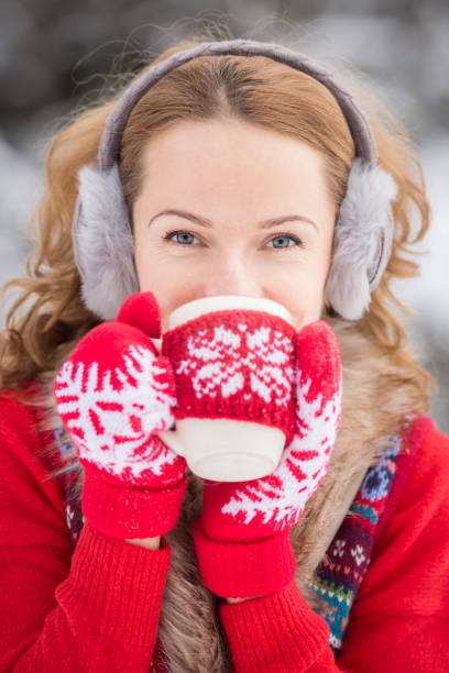 istock Young woman in winter park 828516138