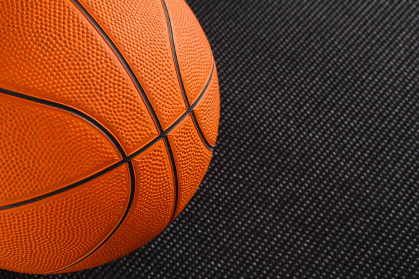 istock Basketball ball on black background copy space 828522170