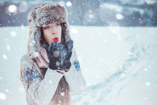 istock Portrait of beautiful girl outdoors while showing 828522706