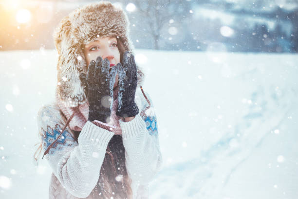 istock Portrait of beautiful girl outdoors while showing 828523092