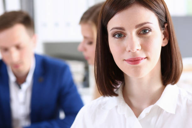 istock Beautiful smiling cheerful girl at workplace 828523610