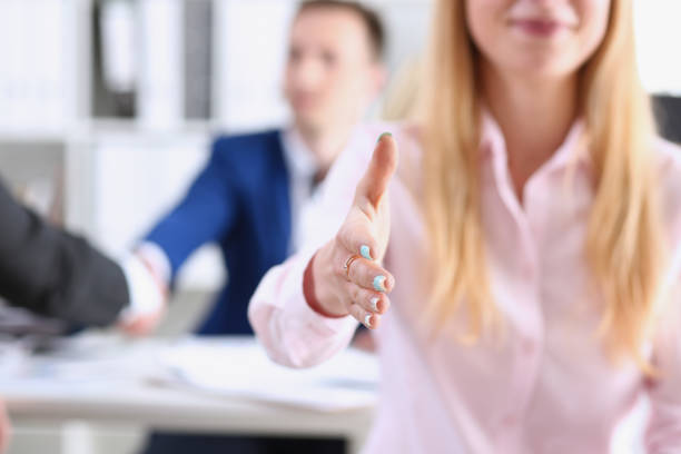 istock Businesswoman offer hand to shake as hello 828523840