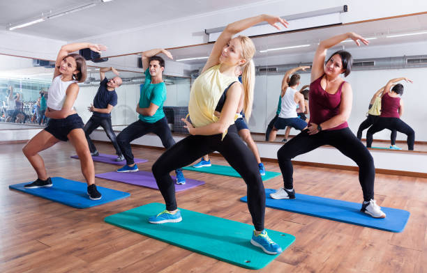 istock Happy adults having group fitness class 828524156