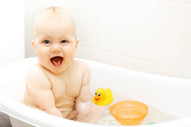 istock happy excited baby taking a bath 828526808