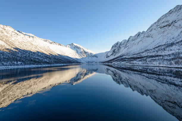 istock Gryllefjorden panoramic view during a beautiful winter day 828527112