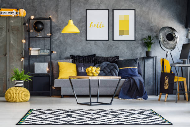 Yellow accents in teenager's room Optimistic teenager's room with gray wall, furniture and yellow accents finch photos stock pictures, royalty-free photos & images