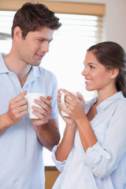 istock Portrait of a happy couple drinking coffee 828536724