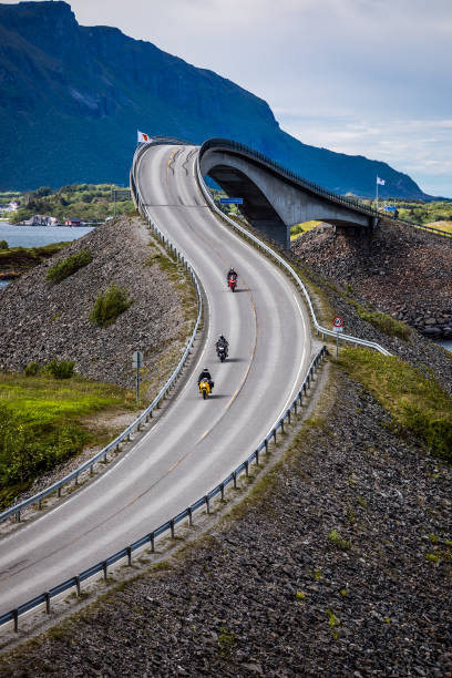 istock Atlantic Ocean Road Two bikers on motorcycles. 828553266
