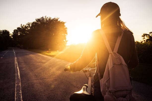 istock Cycling in the park at sunset 828554022