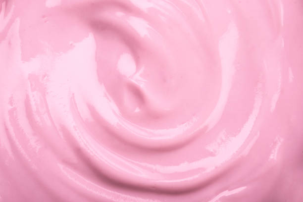 close up the pink creamy homemade blueberries or strawberries yogurt texture background - fruit sauce imagens e fotografias de stock