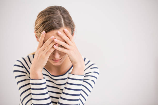 Nervous breakdown, isolated depressed woman Young hopeless woman suffering from depression having nervous breakdown holding head on isolated background, copy space obsessive stock pictures, royalty-free photos & images