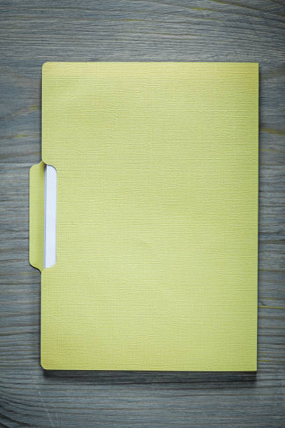 istock Office paper folder on wooden board 828563314