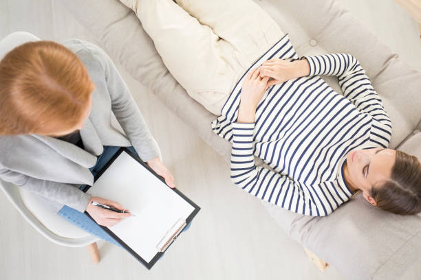 istock High angle, psychotherapy, patient, couch 828563350