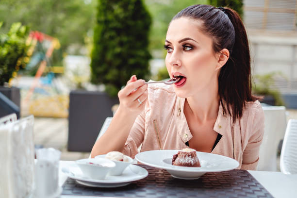 istock Beautiful girl eating souffle in the restaurant 828570976