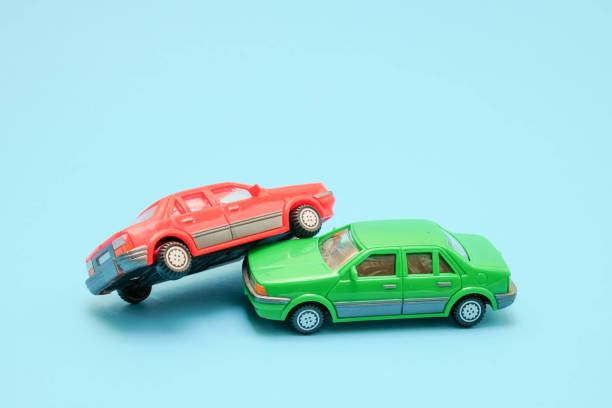 istock Toy cars in accident on a blue background 828575388