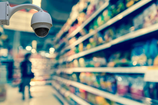 Security camera monitoring on the Abstract blurred photo of store in department store bokeh background, business shopping concept Security camera monitoring on the Abstract blurred photo of store in department store bokeh background, business shopping concept mark goodson screening room stock pictures, royalty-free photos & images