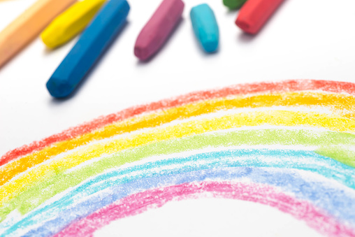 child crayon drawing, rainbow , selective focus