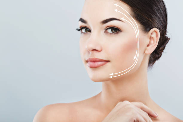 istock Pretty girl with dark hair at gray studio background 828590902