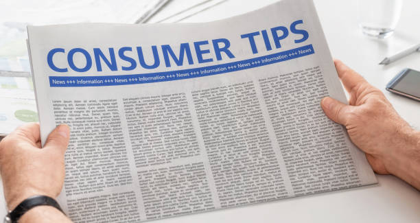 istock Man reading newspaper with the headline Consumer Tips 828603872