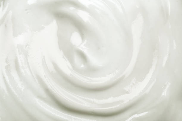 istock close up the white creamy homemade yogurt texture background 828607420