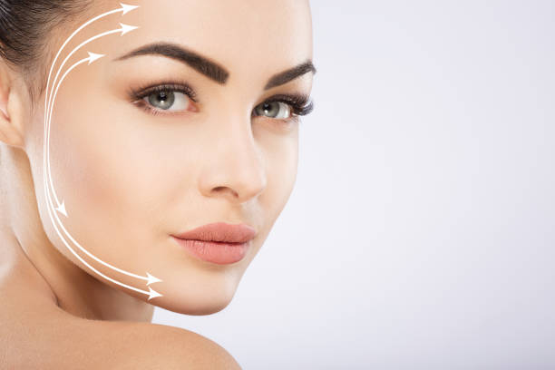 istock Beautiful girl with nude make up at studio background 828607912