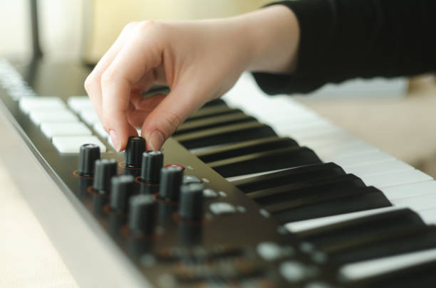 istock woman adjusts the synthesizer 828654000