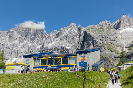 Dachstein mountains, Austria - July 17, 2017: People walking to the valley station of the Austrian Dachstein glacier cable car